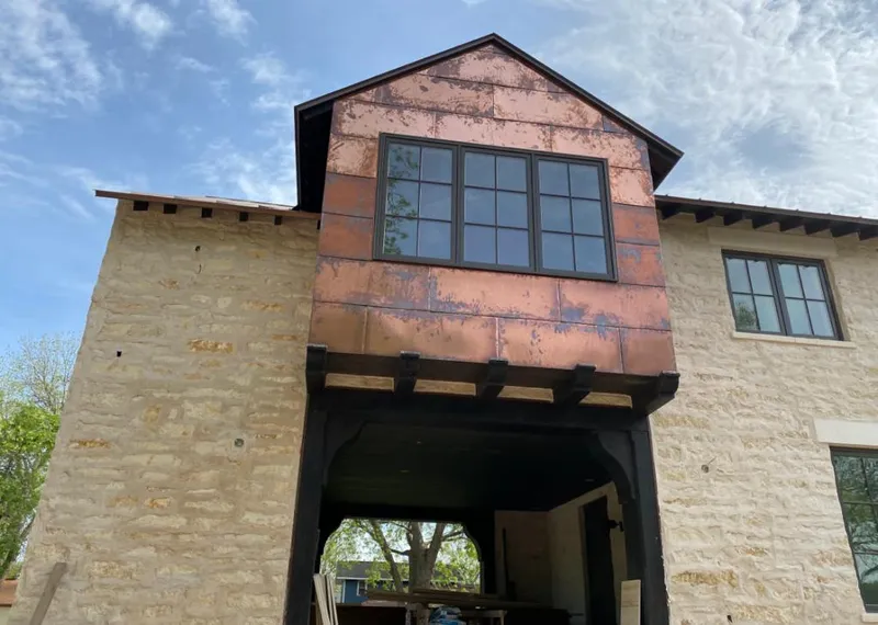 Copper metal panel facade on a stone building for Skylight Installation in Niskayuna