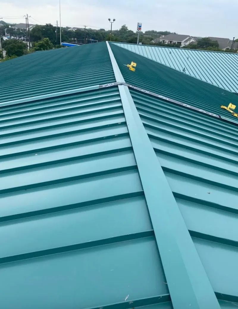 Green commercial metal roof ridge and valley for Metal Roof Repair in Niskayuna